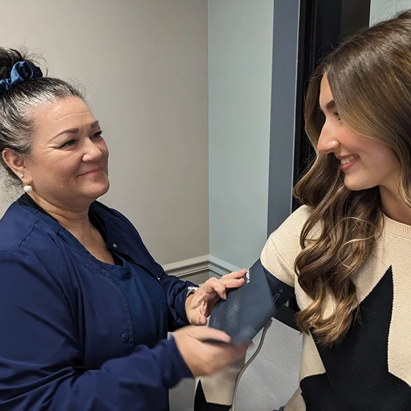 Picture of a patient taking a blood pressure test