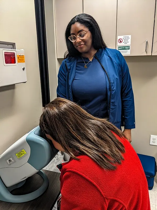 Nurse giving a vision test to a patient