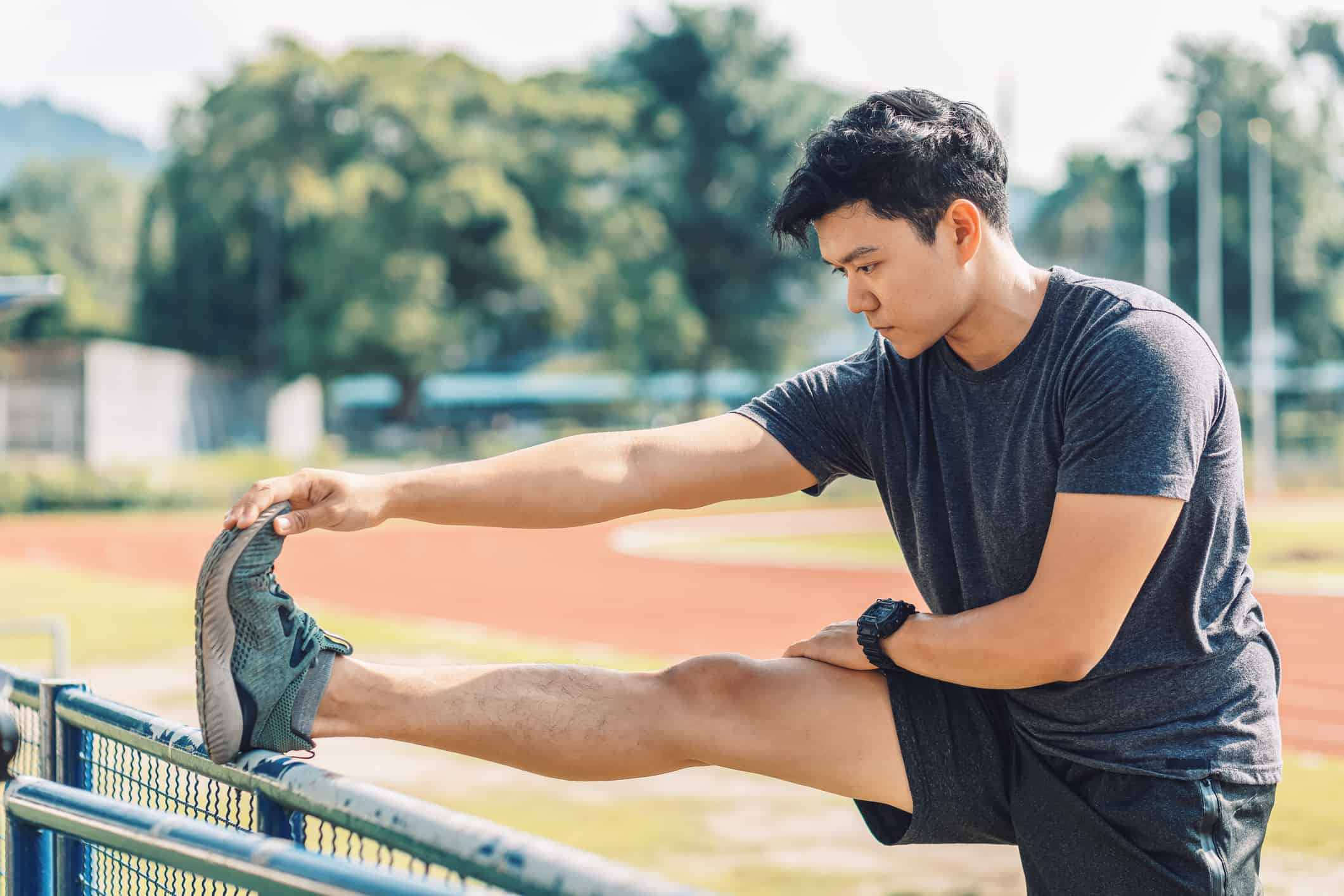 A man stretching before running.